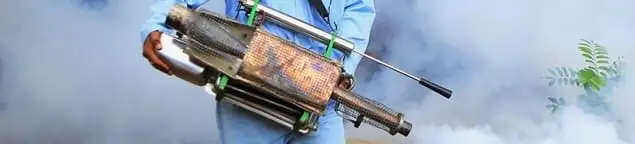 Fumigation technician using a fogger for deep pest treatment in Wichita, KS